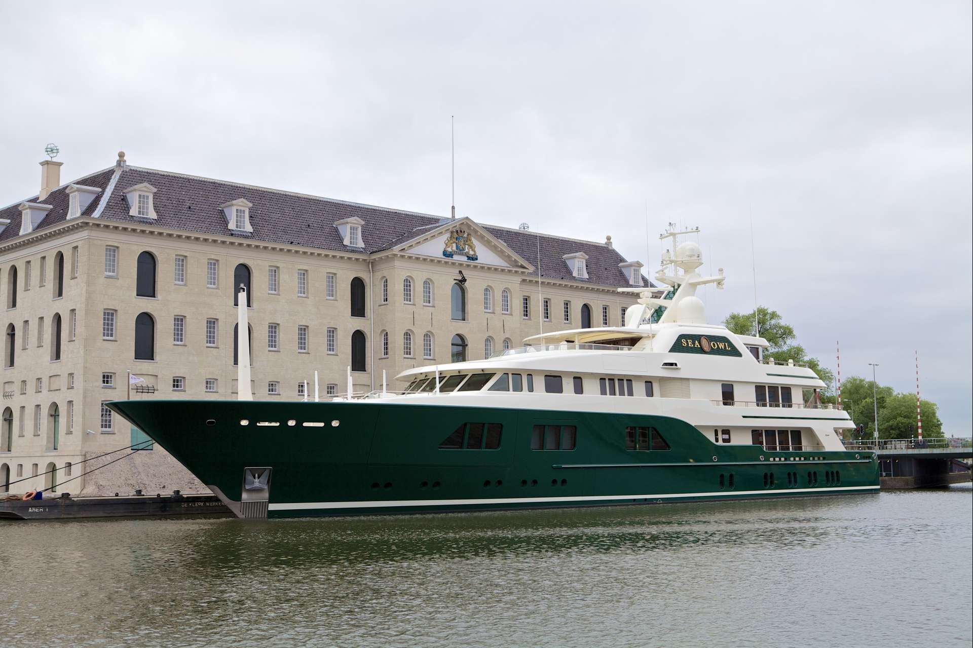 green hulled super yacht