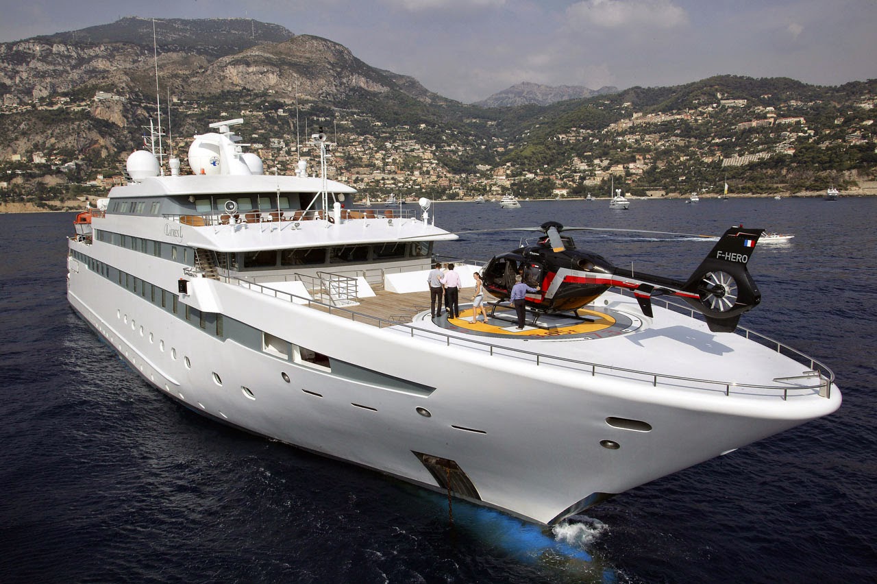 big yacht with helicopter
